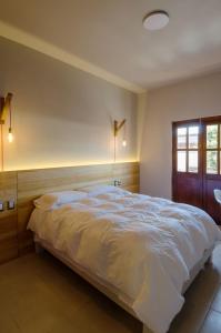 Ένα ή περισσότερα κρεβάτια σε δωμάτιο στο Comala Bed & Breakfast