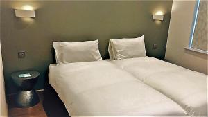 Postel nebo postele na pokoji v ubytování RIOSHOUSE Henley