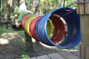 a red yellow and blue hose on a playground at Old Lake Golf Hotel in Tata