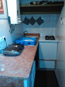 a small kitchen with a sink and a counter top at Inglesinhos 1 in Lisbon