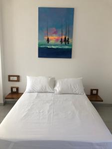 Postel nebo postele na pokoji v ubytování Dasu’s Restaurant & Villa