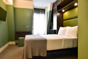 Ένα ή περισσότερα κρεβάτια σε δωμάτιο στο My Story Hotel Augusta