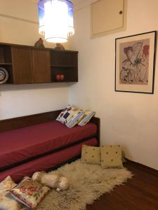 a living room with a red couch and a rug at Luxury apartment close to city center, university and children's hospital in Athens