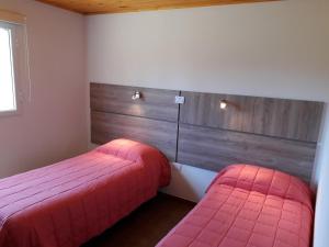 Postel nebo postele na pokoji v ubytování Aluminé Cabañas