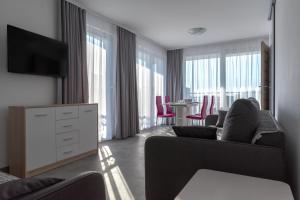 TV a/nebo společenská místnost v ubytování Apartmani Dalmacjia