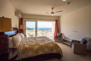 Postel nebo postele na pokoji v ubytování Blue Bay Apartments + 37 fotografií