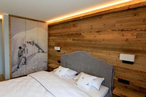 Säng eller sängar i ett rum på Almlodge Westendorf