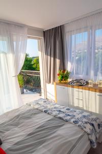 Postel nebo postele na pokoji v ubytování Apartmani Dalmacjia
