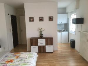 a small room with a bed and a kitchen at Studio Lora S 101 in Saint-Louis