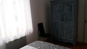 Ένα ή περισσότερα κρεβάτια σε δωμάτιο στο Appartement Taïko