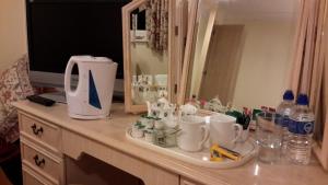 a bathroom counter with a sink and a mirror at St Algars b&b in Wimborne Minster