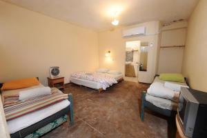 Postel nebo postele na pokoji v ubytování Spice Quarter Inn