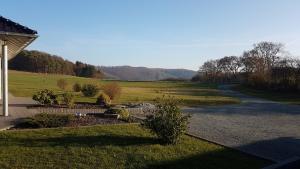 a view of a field and a road at Ferienwohnung FERRUM in Korbach