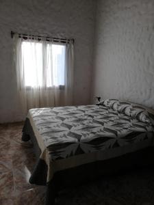 Una cama o camas en una habitación de Casa Benjaim