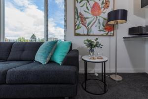 a living room with a couch and a table at Bay 10 - Suites and Apartments in Port Lincoln