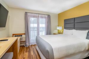Postel nebo postele na pokoji v ubytování Grey Fox Inn
