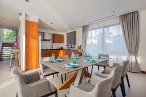 a dining room with a table and chairs at Villa Palavee (A2) in Ao Nang Beach