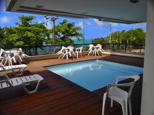 a pool on the deck of a cruise ship at Seaflats - Meireles - Villa Costeira in Fortaleza
