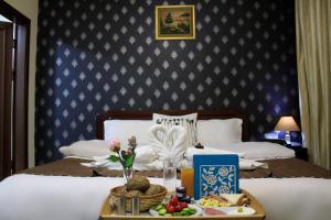 Giường trong phòng chung tại Al-Aqsa Palace Hotel فندق قصر الاقصى