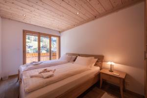 Postel nebo postele na pokoji v ubytování Chalet Aquila 8 Penthouse