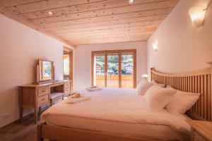 Postel nebo postele na pokoji v ubytování Chalet Aquila 8 Penthouse