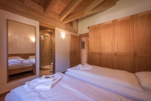 Postel nebo postele na pokoji v ubytování Chalet Aquila 8 Penthouse