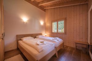 Postel nebo postele na pokoji v ubytování Chalet Aquila 8 Penthouse