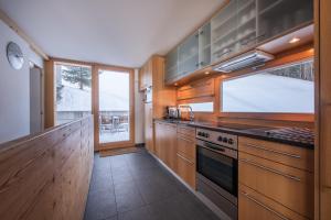 Kuchyň nebo kuchyňský kout v ubytování Chalet Roossi 3