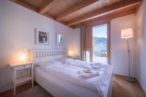 Postel nebo postele na pokoji v ubytování Chalet Roossi 3