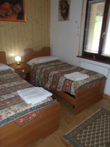 Ein Bett oder Betten in einem Zimmer der Unterkunft Albergo Riglarhaus