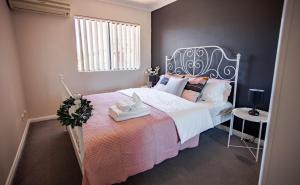 A bed or beds in a room at your home here in Sydney