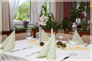 a table with wine glasses and napkins on it at Gasthof BLASL Margaretha in Losenstein