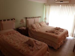 Кровать или кровати в номере MIL ROSAS