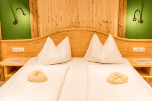 Postel nebo postele na pokoji v ubytování Das kleine Bio Hotel Tiefenbach