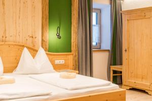 Postel nebo postele na pokoji v ubytování Das kleine Bio Hotel Tiefenbach