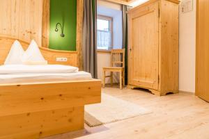 Postel nebo postele na pokoji v ubytování Das kleine Bio Hotel Tiefenbach
