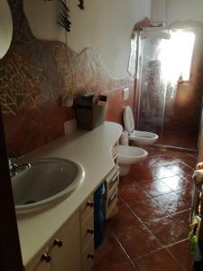 a bathroom with a sink and a toilet at Apartmán Alice in Jablonec nad Jizerou