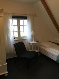 Säng eller sängar i ett rum på Das Ostseehotel