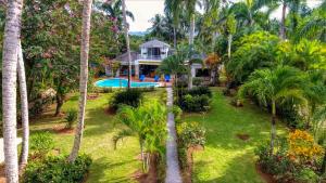 an aerial view of a house with palm trees at Casa Inca in Las Terrenas