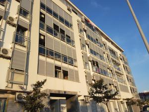 a large building with windows on the side of it at Delta Apartment in Podgorica