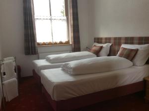 Łóżko lub łóżka w pokoju w obiekcie Kitz Residenz Top 6