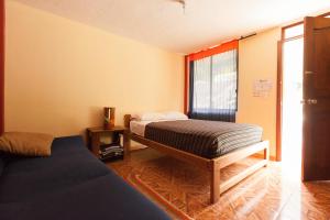 Letto o letti in una camera di Papachos Hostel