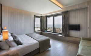 Een bed of bedden in een kamer bij Hotel Arcadia Blue Istanbul