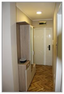 a room with a hallway with a door and a room with a floor at Apartment Libra in Novi Sad +14 photos