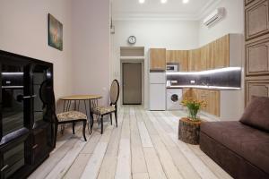 a living room with a couch and a table at D5 Apartments in Odesa
