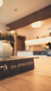 a tag that says does application on a table at Haus Schlager "dasAppartement" in Annaberg im Lammertal