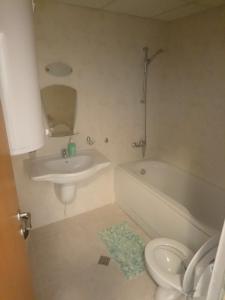 a bathroom with a sink and a tub and a toilet at Studio L006 in Aspen Golf in Bansko +22 photos