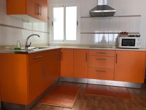 Kuchyň nebo kuchyňský kout v ubytování Apartamentosánchez