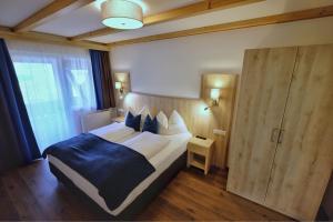 Posteľ alebo postele v izbe v ubytovaní Aktiv Hotel Karnia