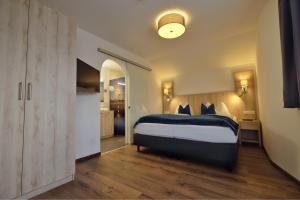 Posteľ alebo postele v izbe v ubytovaní Aktiv Hotel Karnia